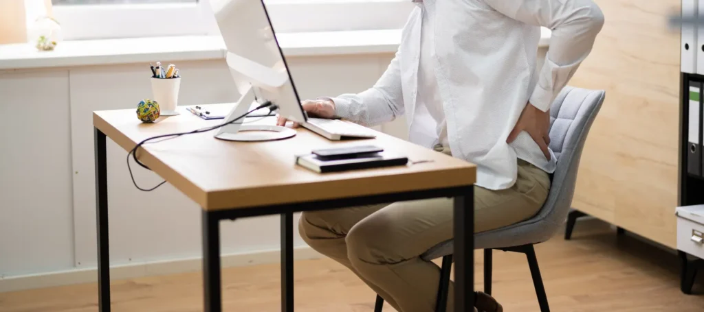 Simple PT Tips To Stop Slouching And Reduce Back Pain At Your Desk